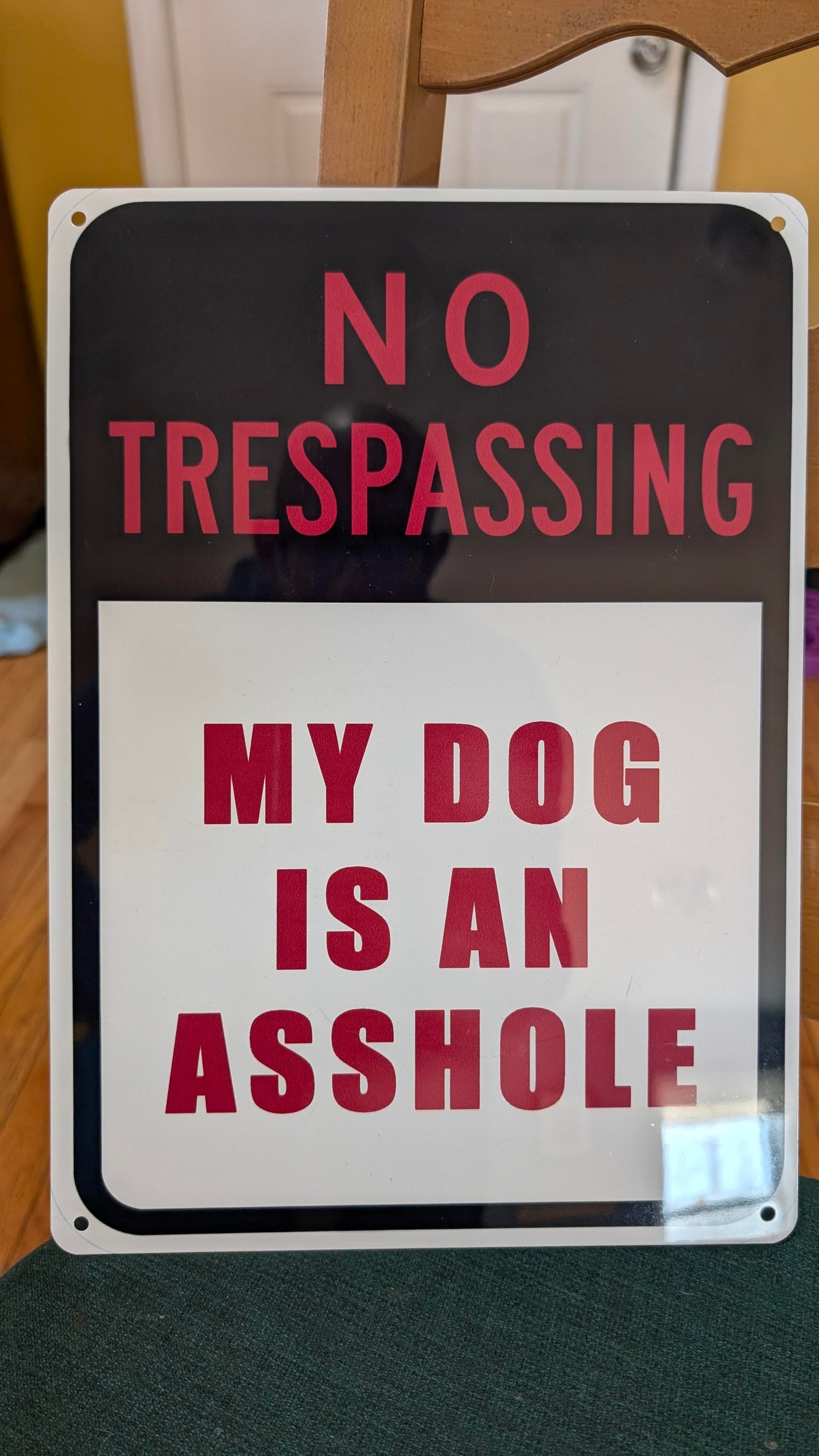 My dog is an asshole sign