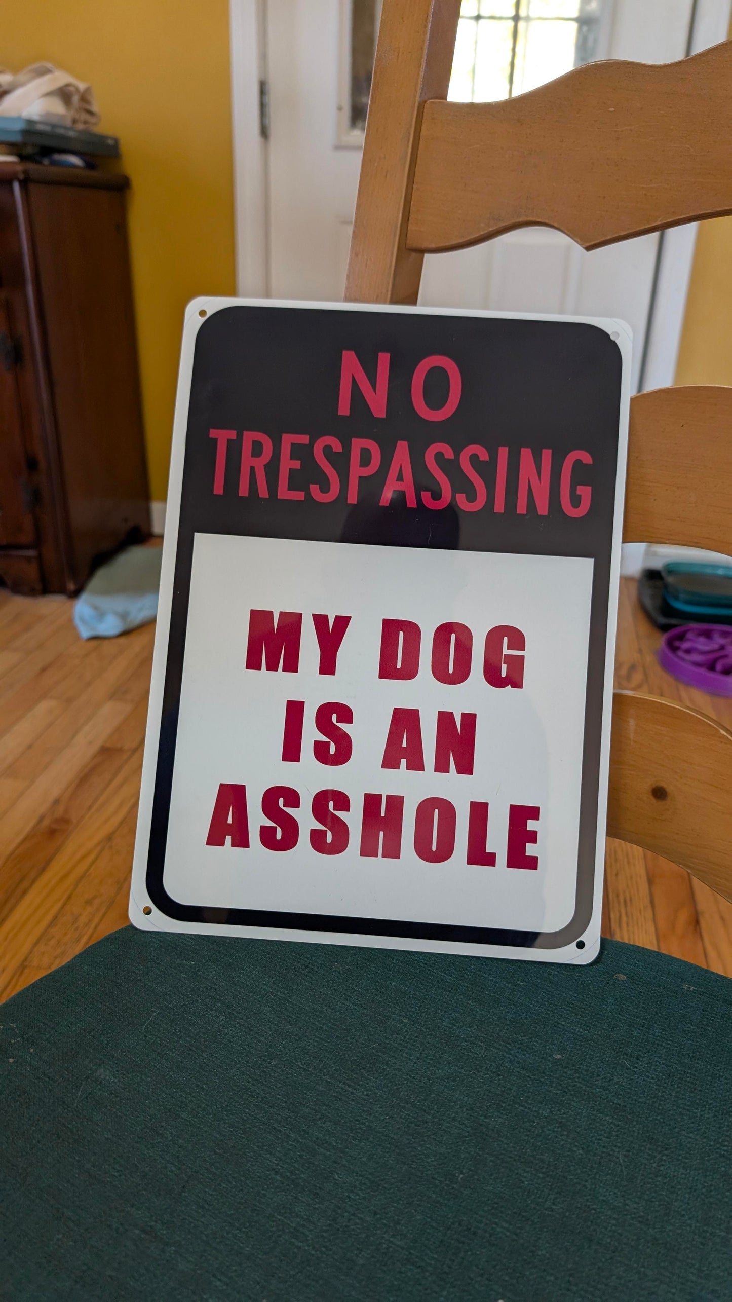 My dog is an asshole sign